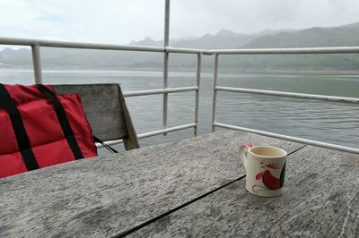 Empty chairs in water