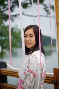 Portrait of smiling girl standing outdoors