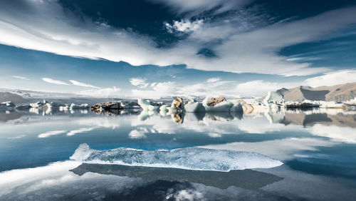 Scenic view of snowcapped mountains against sky during winter