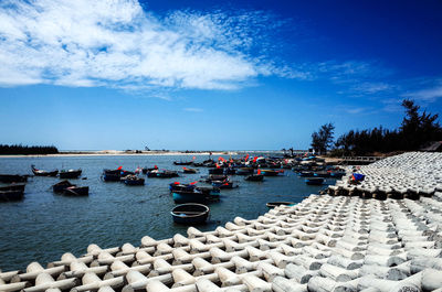 Boats in sea against sky