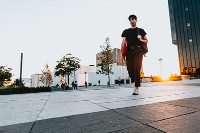 Portrait of young man standing on street