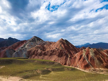 View of mountain range against cloudy sky