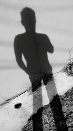 Shadow of man on beach