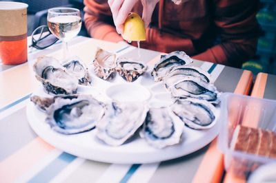 Oyster served with white wine in a restaurant