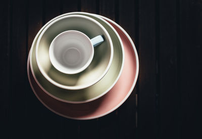 Overhead view of empty cup and bowls on table