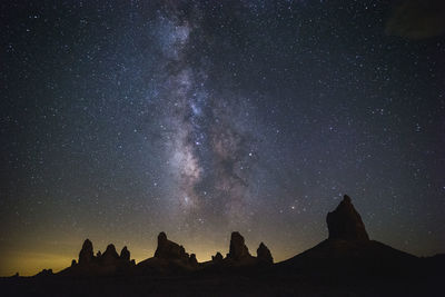 Milky way rising above the silhouetted tufa of trona pinnacles