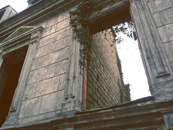 Low angle view of old building against sky