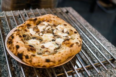 Close-up of pizza in plate on table