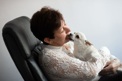 Rear view of woman with dog