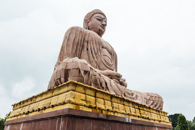 Low angle view of statue against sky