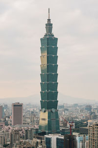 Modern buildings in city against sky