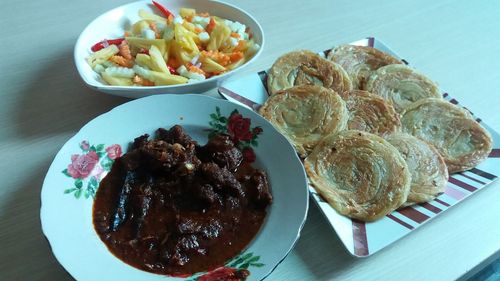 Close-up of served food on table