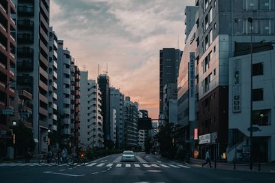 Street amidst buildings against sky