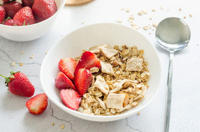 High angle view of strawberries in bowl on table