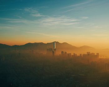 Aerial view of cityscape during sunset