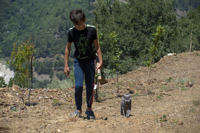 Portrait of senior man standing on field