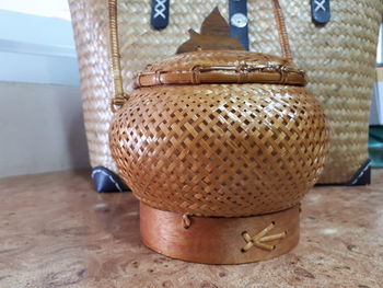 Close-up of wicker basket on table at home