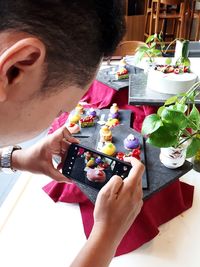 High angle view of woman hand on table