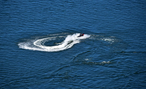 High angle view of person jet boating on sea