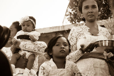 Portrait of mother and daughter outdoors