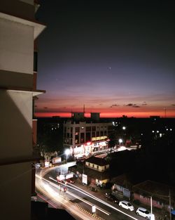 High angle view of illuminated buildings in city at night