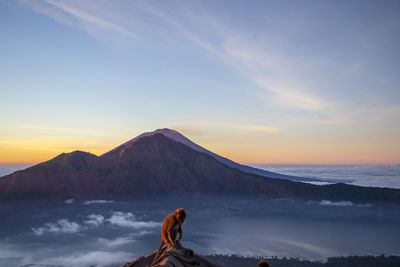 Scenic view of snowcapped mountains against sky during sunset