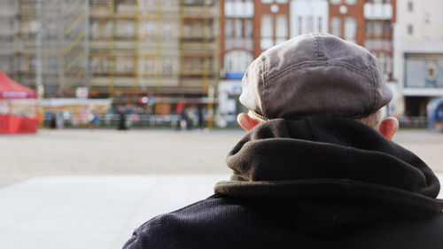 Rear view of man on street in city