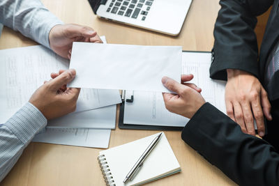 High angle view of people on table