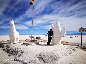 Rear view of people on snow covered land