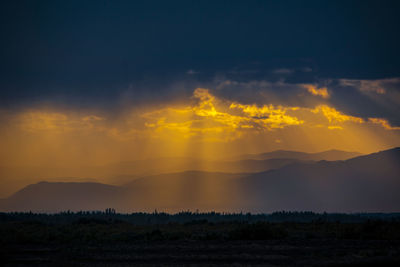 Scenic view of silhouette landscape against sky during sunset