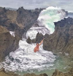 Man surfing in sea