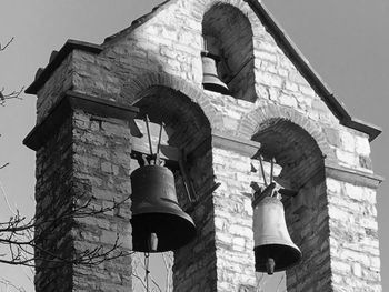 Low angle view of bell tower against building