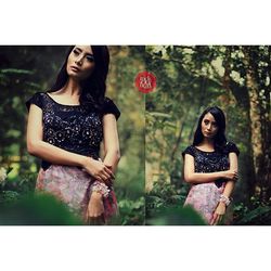 Portrait of a beautiful young woman standing against trees