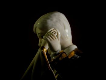 Close-up of stuffed toy against black background