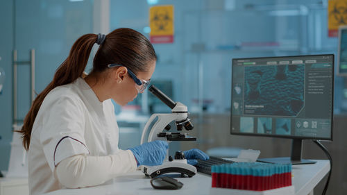Female scientist experimenting at laboratory