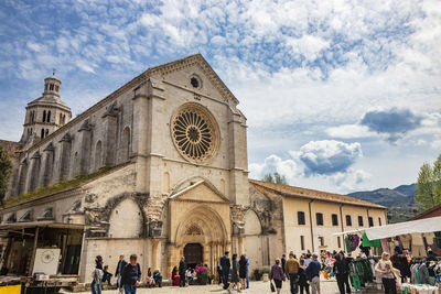 Group of people in front of historic building