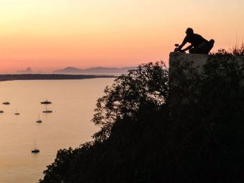 Silhouette of people at sunset