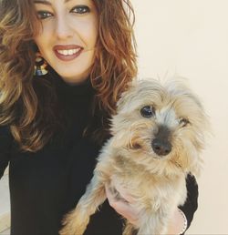 Portrait of young woman with dog