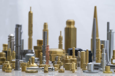 Close-up of city made with machine parts arranged on table