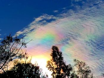 Low angle view of rainbow in sky