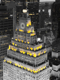 High angle view of illuminated buildings in city