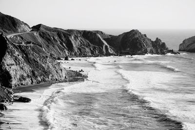 Scenic view of beach against clear sky