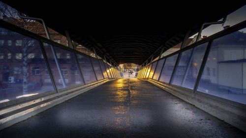 Illuminated bridge at night