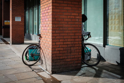 Bicycle on sidewalk by building