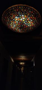 Low angle view of illuminated ceiling light