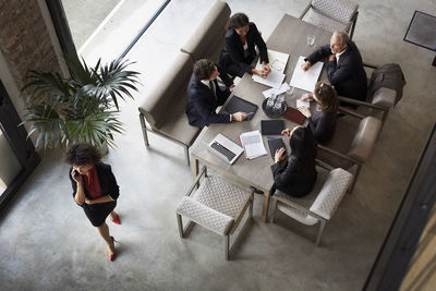 Team of financial advisors planning with business colleagues during meeting at law firm