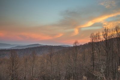 Scenic view of mountains against sky during sunset