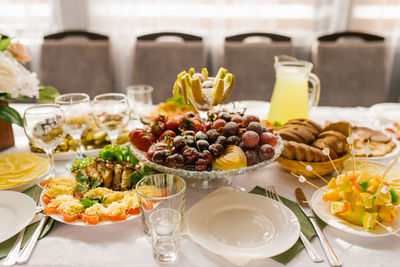 Banquet table with food and snacks at a wedding, birthday or party