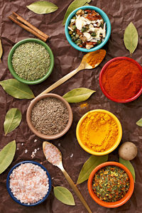 High angle view of multi colored bowls on table