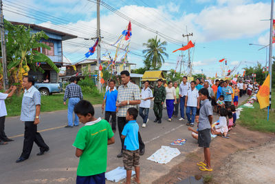 People in city against sky